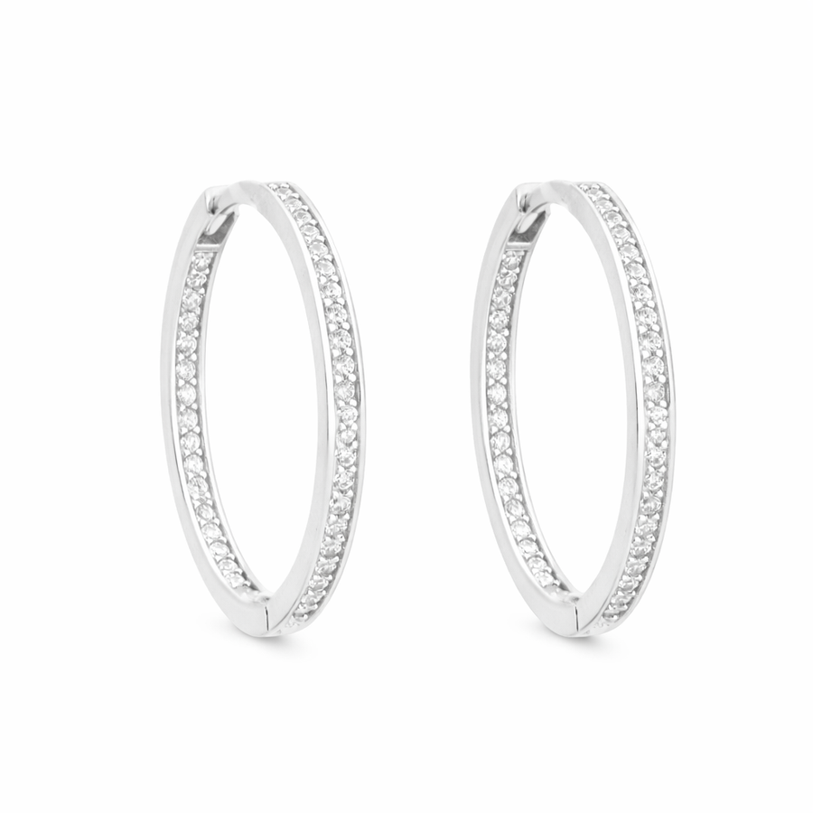 Boucles d'oreilles Huggies en or blanc 10 kt avec zircons